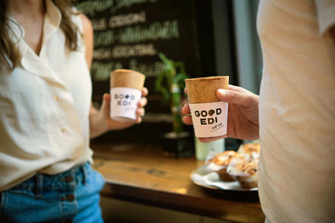 trendy cafe people enjoying Good Edi edible coffee cups